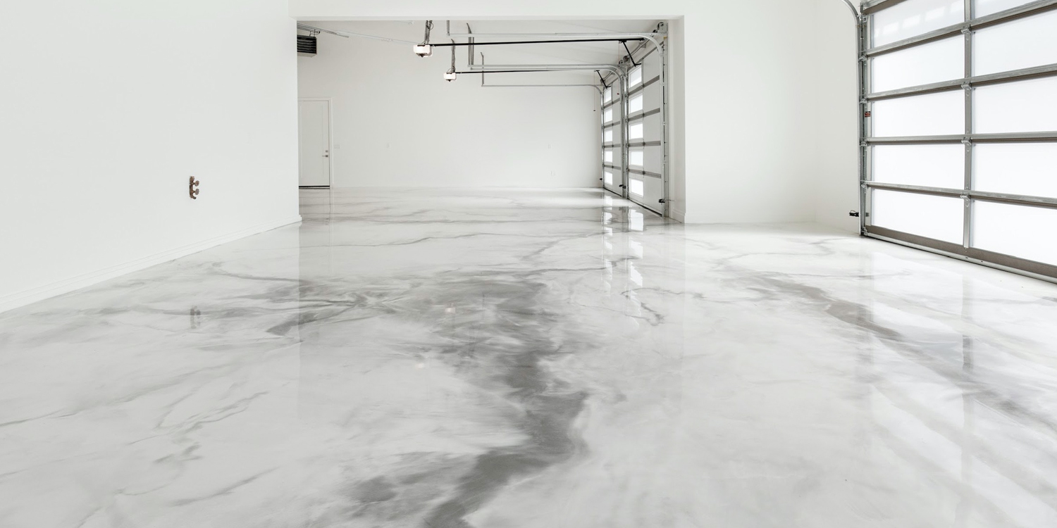 Empty garage with epoxy flooring that looks like marble